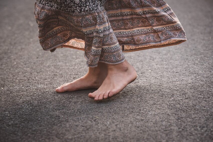 woman earthing - walking barefoot